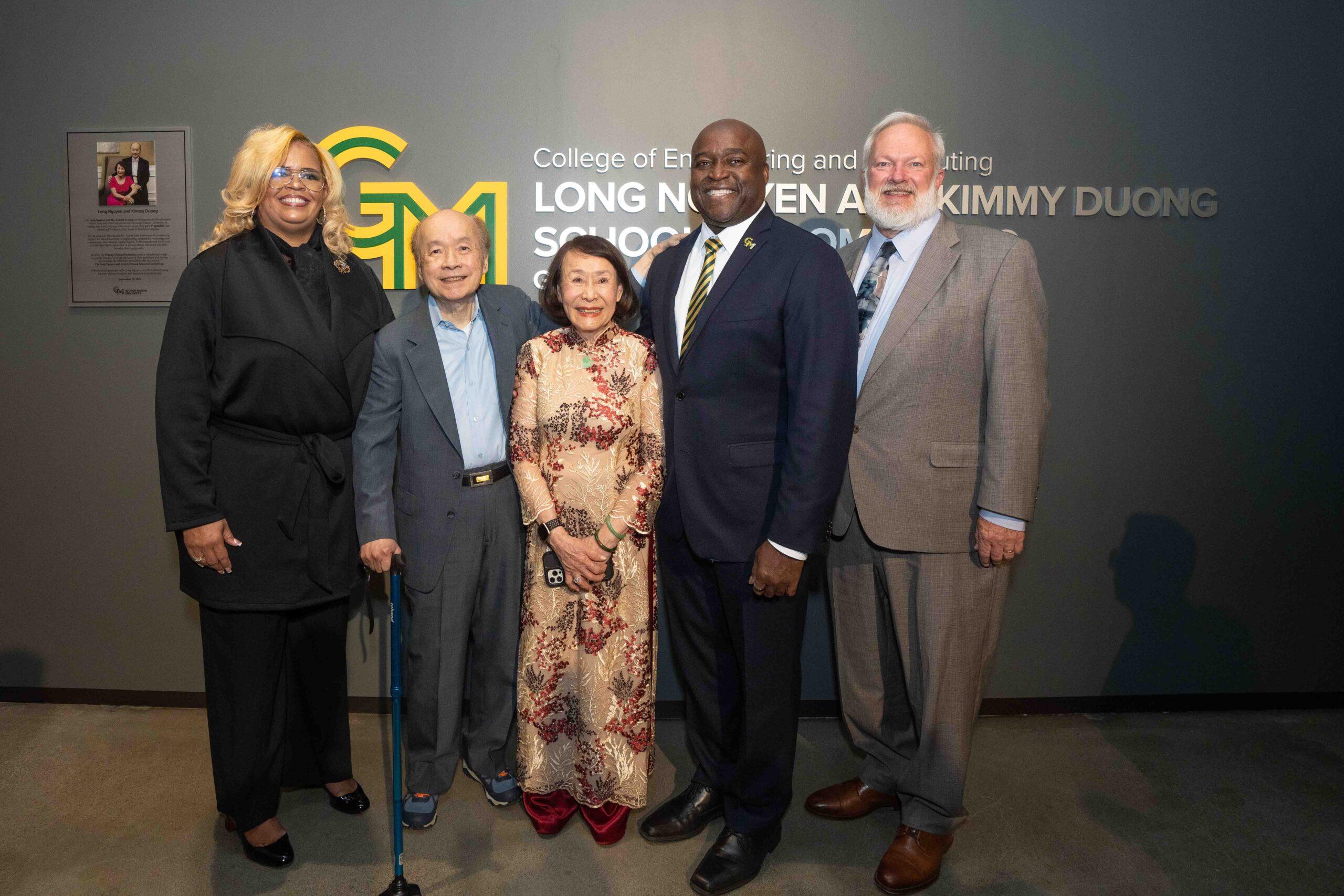 Vice President for Advancement and Alumni Relations Trishana E. Bowden (pictured left to right) poses with Long Nguyen and Kimmy Duong, President Gregory Washington, and College of Engineering and Computing Dean Ken Ball next to the namesake sign for the Long Nguyen and Kimmy Duong School of Computing at the Grand Celebration for Fuse at Mason Square.