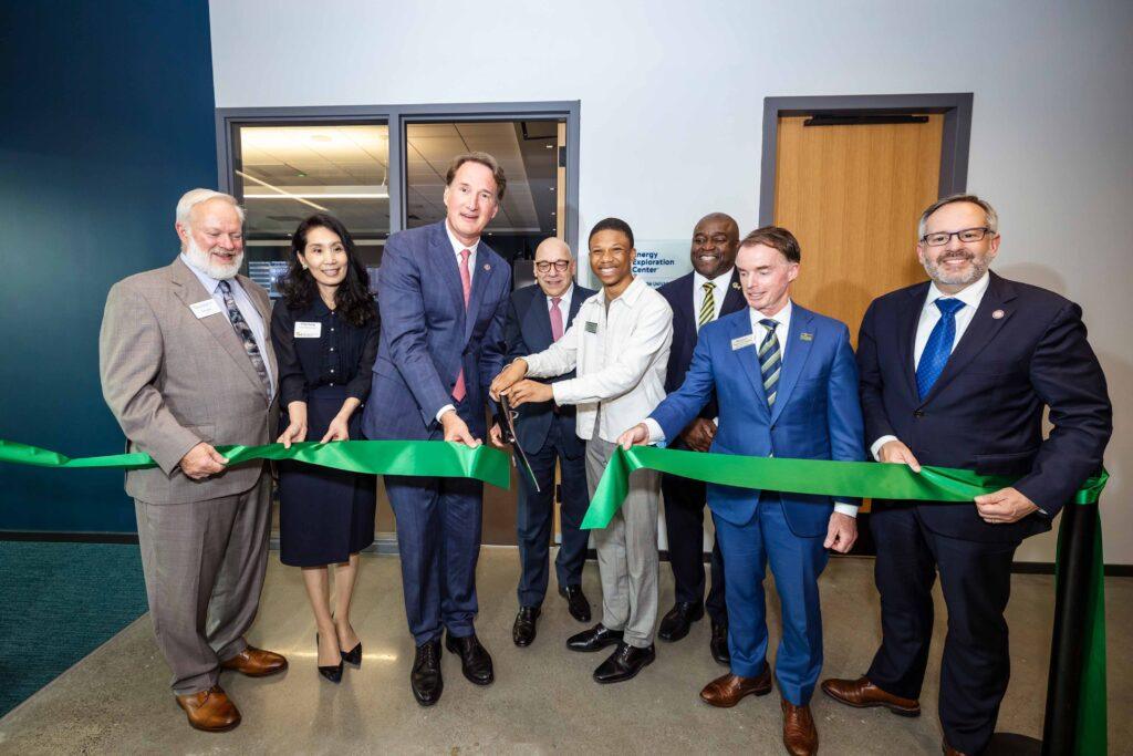 Dignitaries cut the ribbon for the E2 Center at the Grand Celebration for Fuse at Mason Square. 