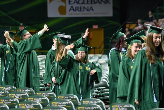 The Mason LIFE cohort processing into EagleBank Arena during the College of Education and Human Development's Degree Celebration.