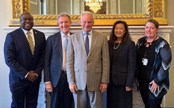 George Mason President Gregory Washington, Inova Health System's John Moynihan, Sen. Tim Kaine (D-VA), Labouré College of Healthcare President Lily Hsu, Ascentria Care Alliance President and CEO Angela Bovill stand together for a group photo. 