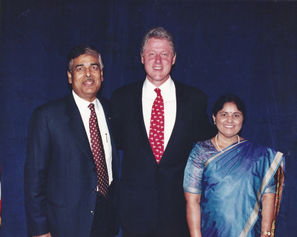 The late S.P. "Shri" Shrivastava and his wife, Sudha Shrivastava, pictured with former President Bill Clinton. 