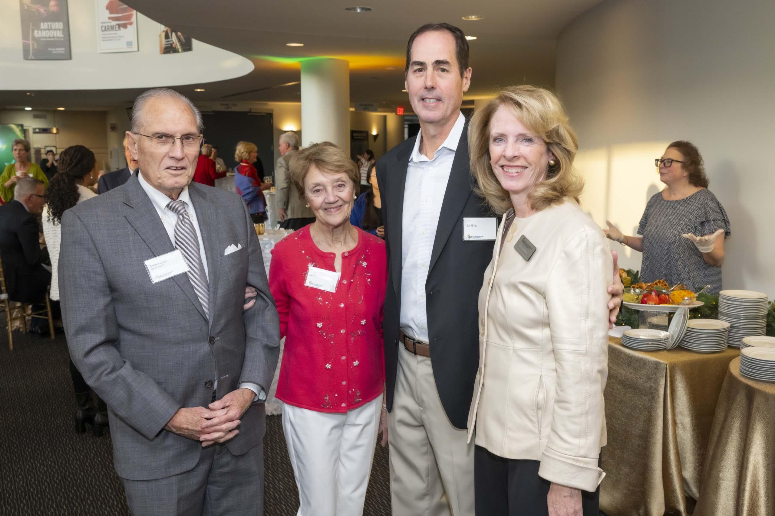 Four 2024 Winter Celebration of Giving reception attendees.