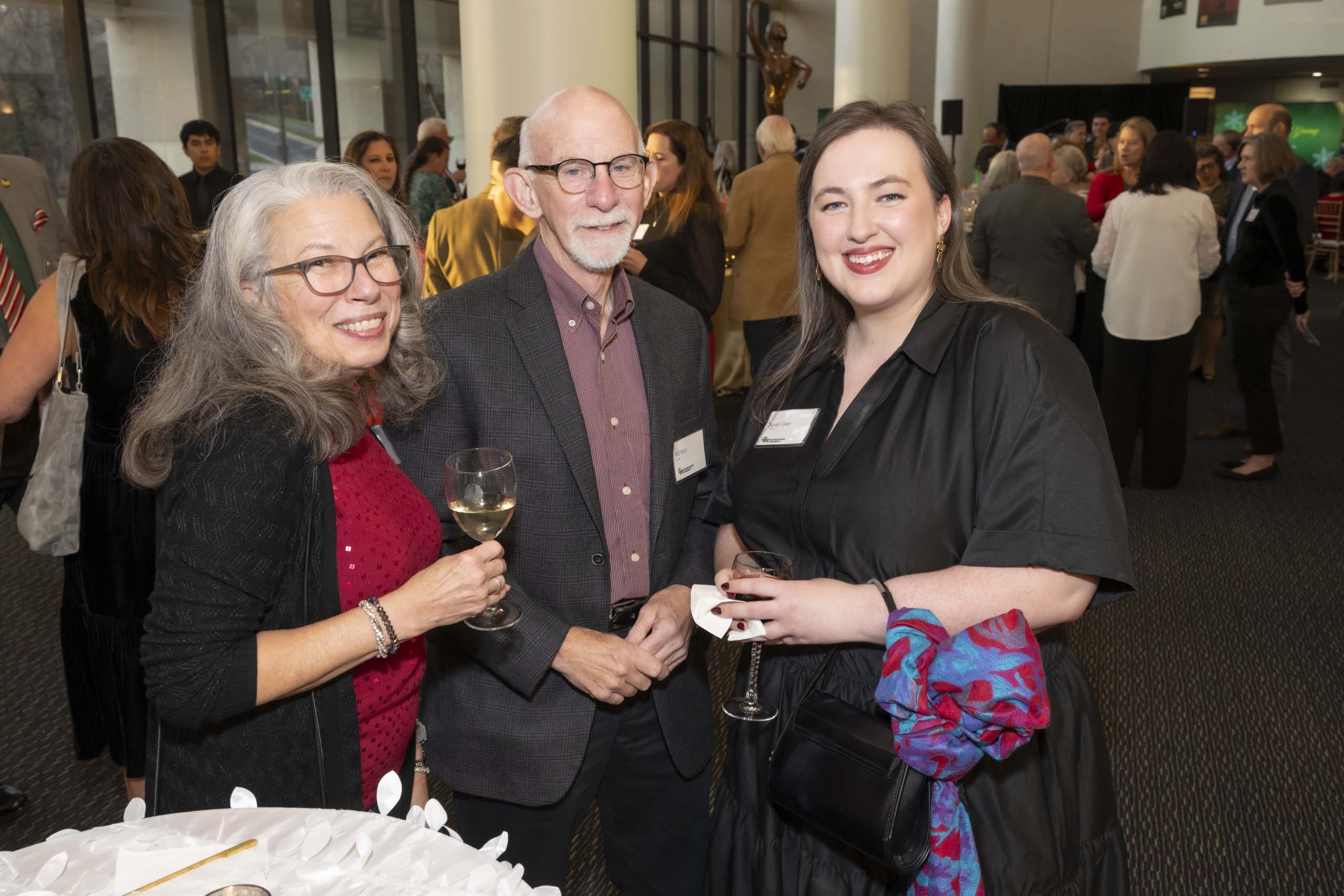 Three 2024 Winter Celebration of Giving reception attendees.