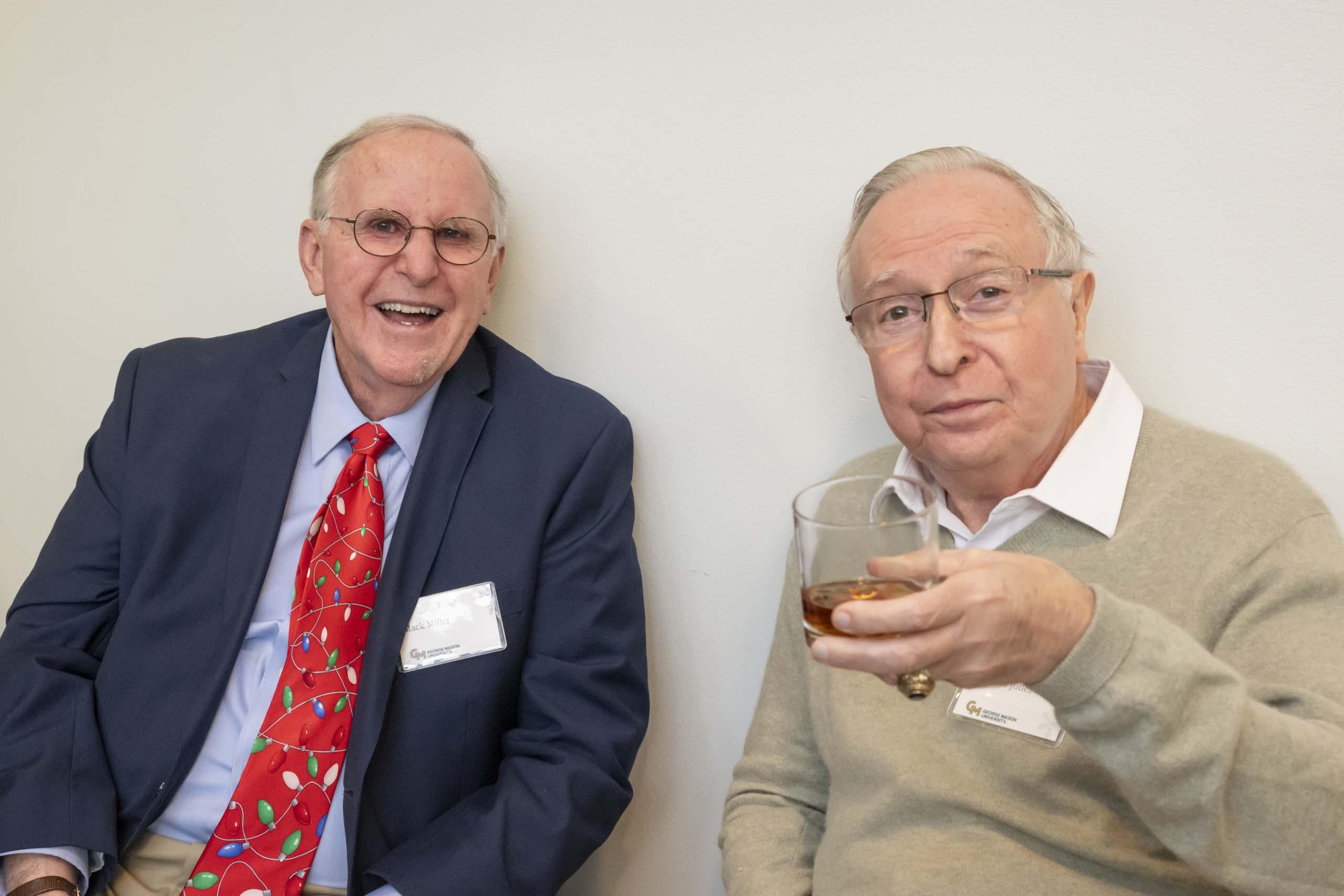 Two 2024 Winter Celebration of Giving reception attendees.