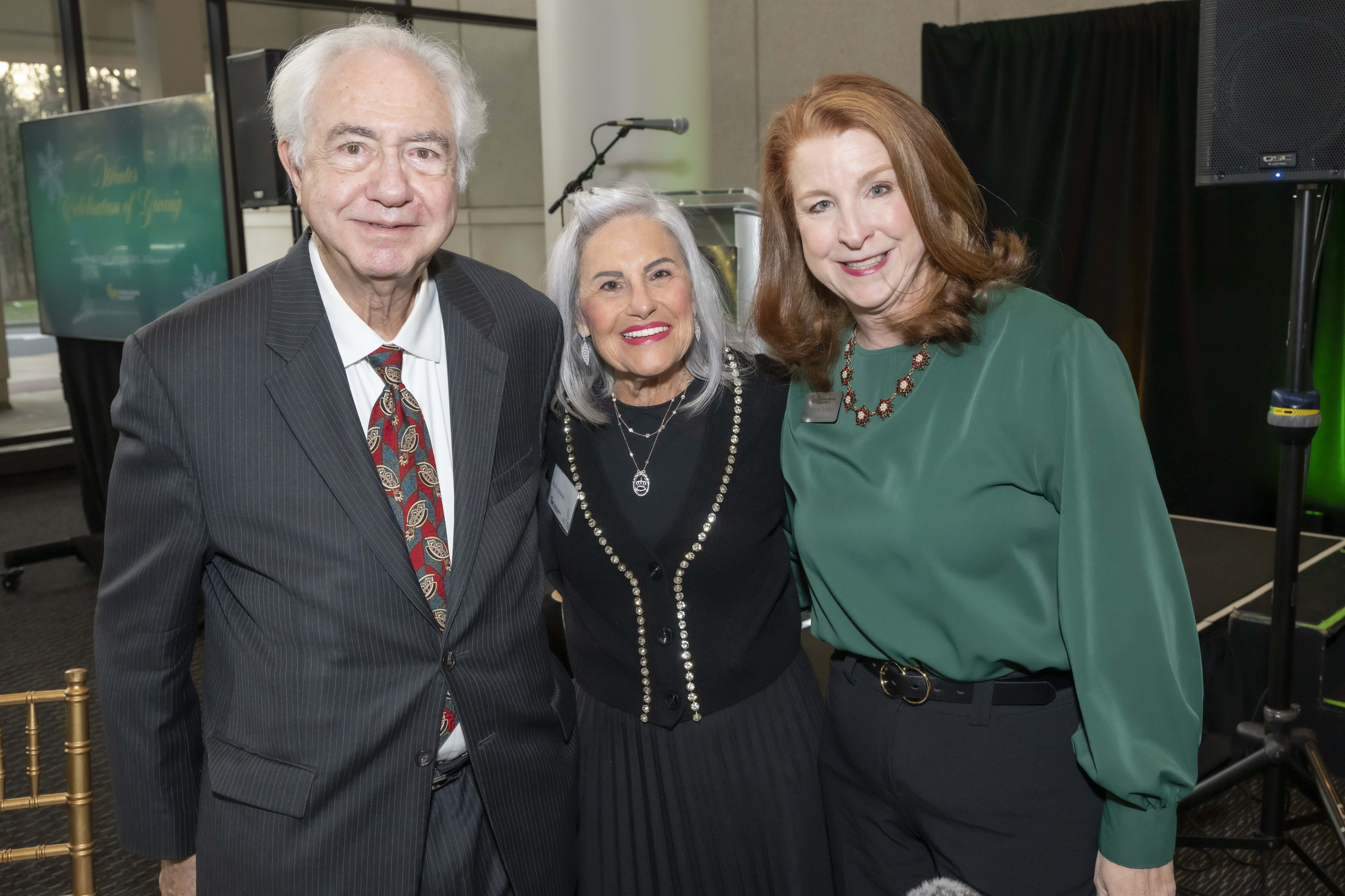 Three 2024 Winter Celebration of Giving reception attendees.