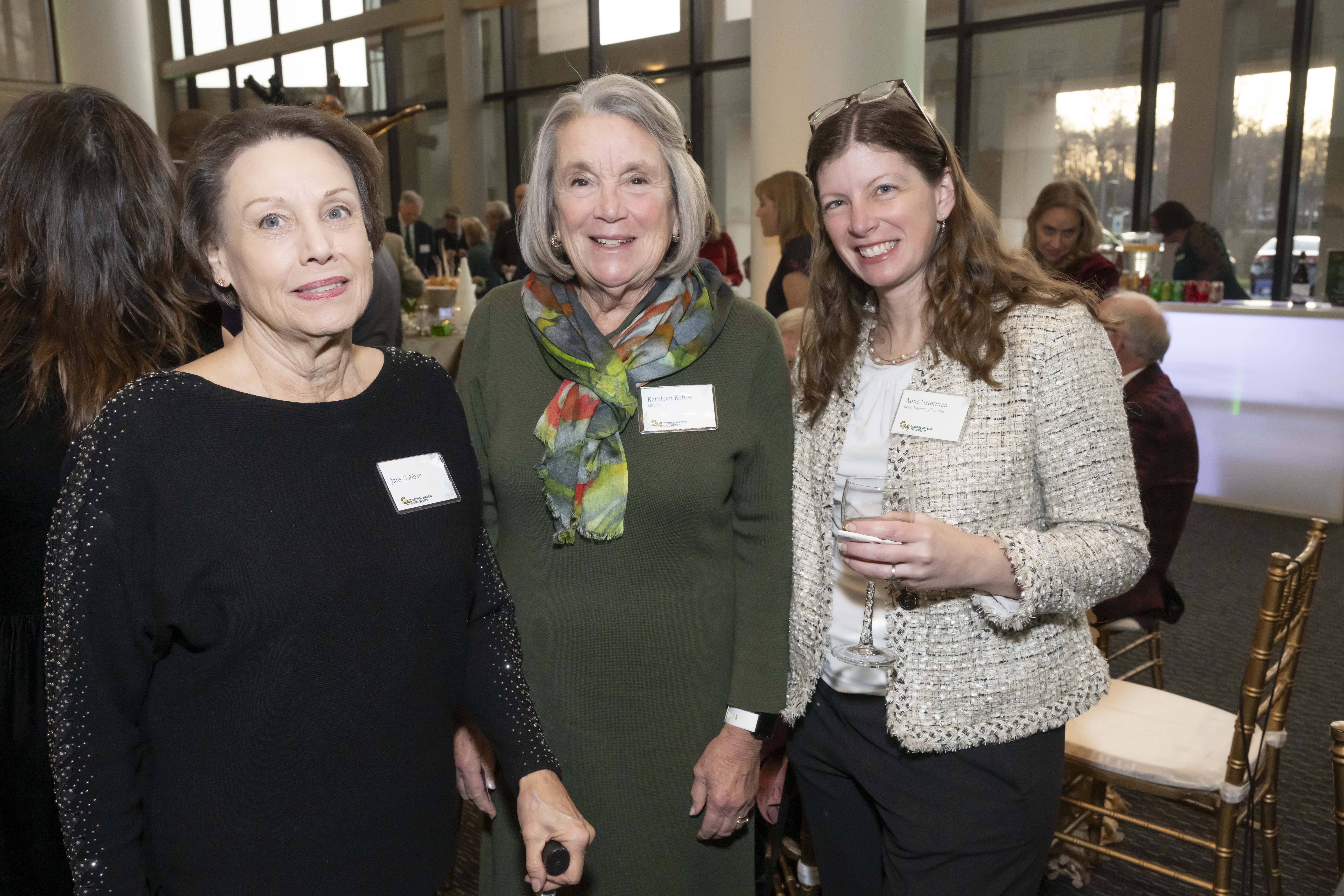Three 2024 Winter Celebration of Giving reception attendees.