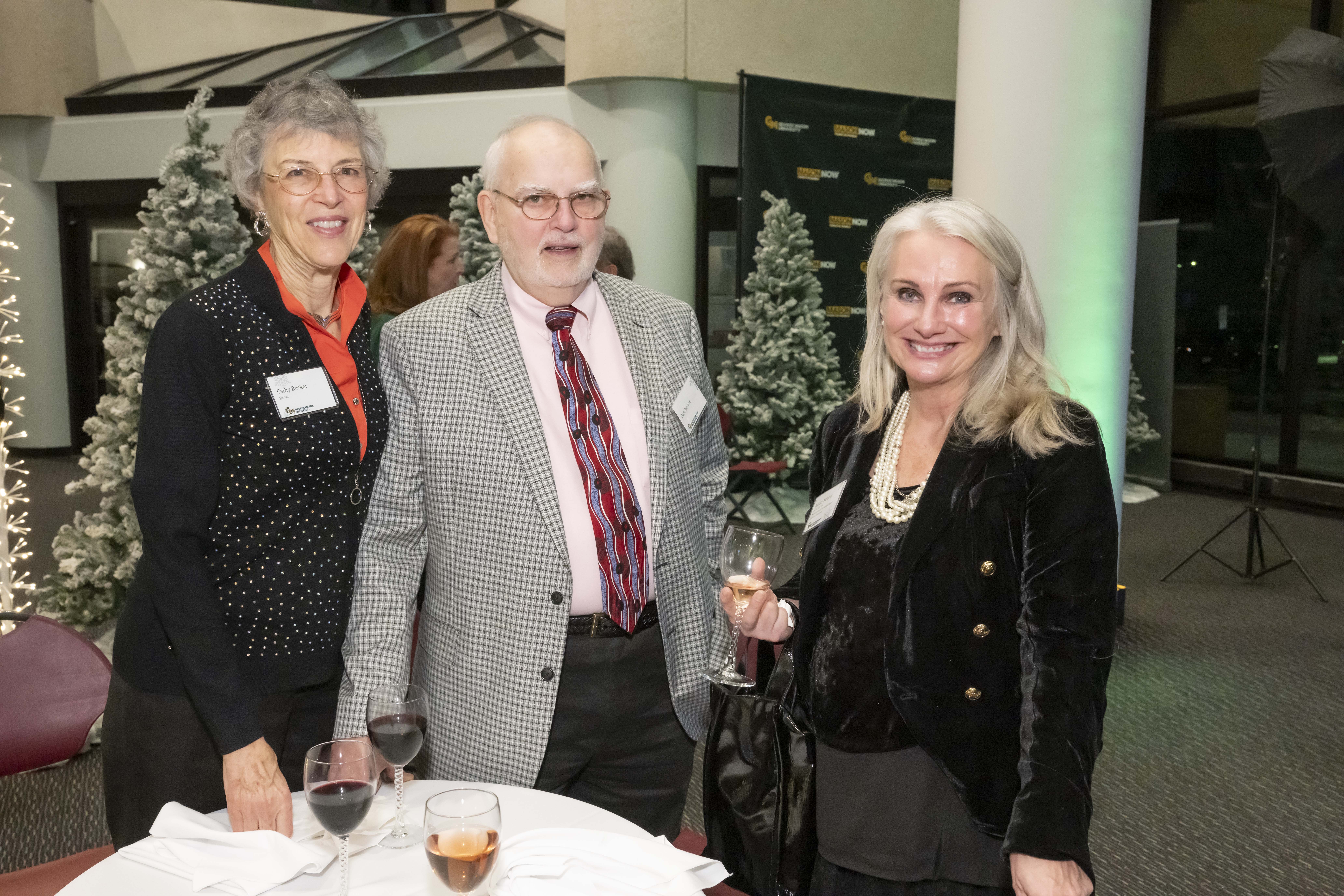 Three 2024 Winter Celebration of Giving reception attendees.