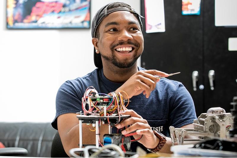 Student working with electrical device