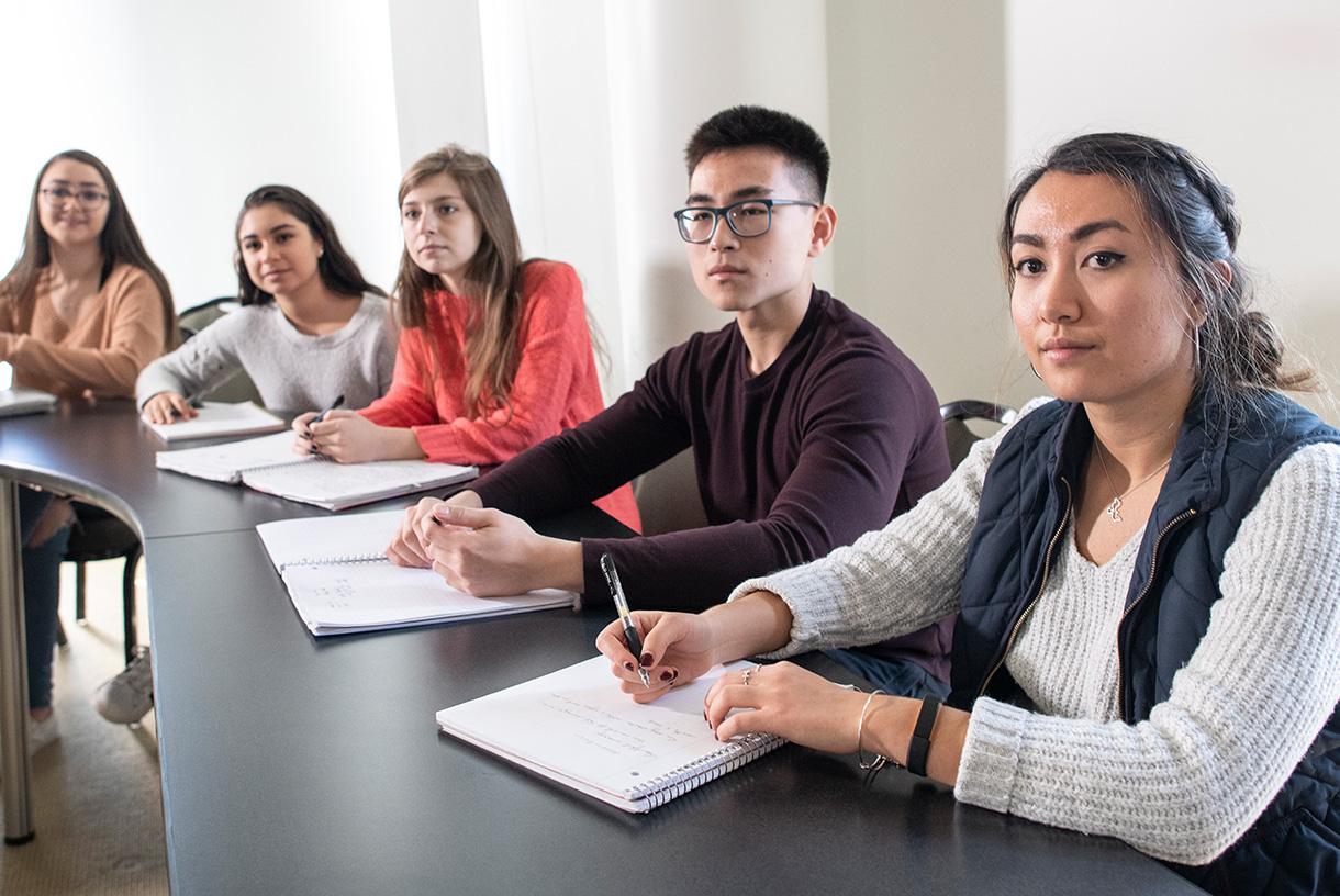 Five students seated together