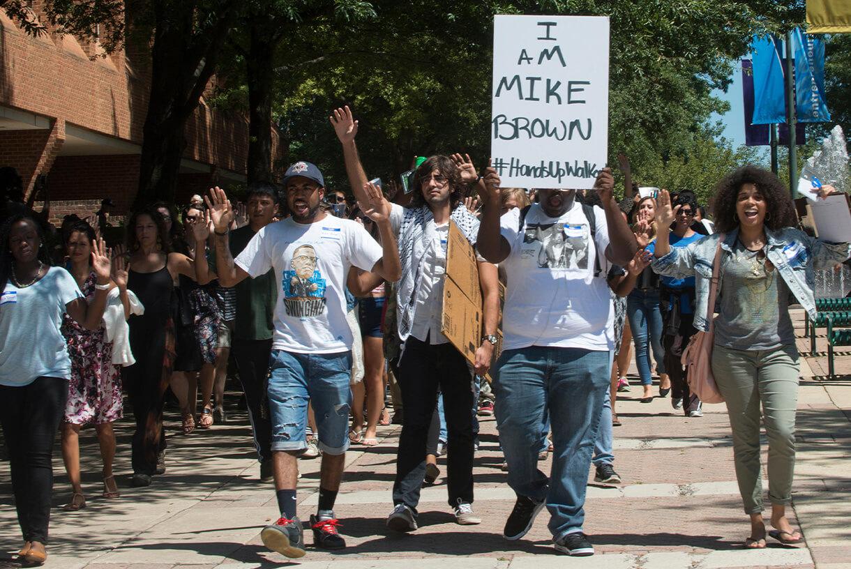 Students during peaceful protest and holding signs