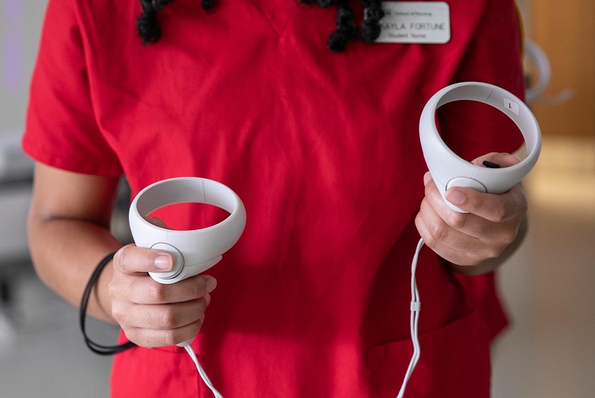Close up of nursing student holding VR