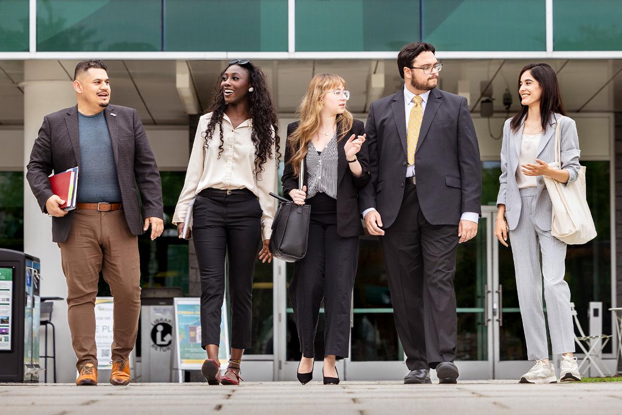 Mixed staff walking out the door together