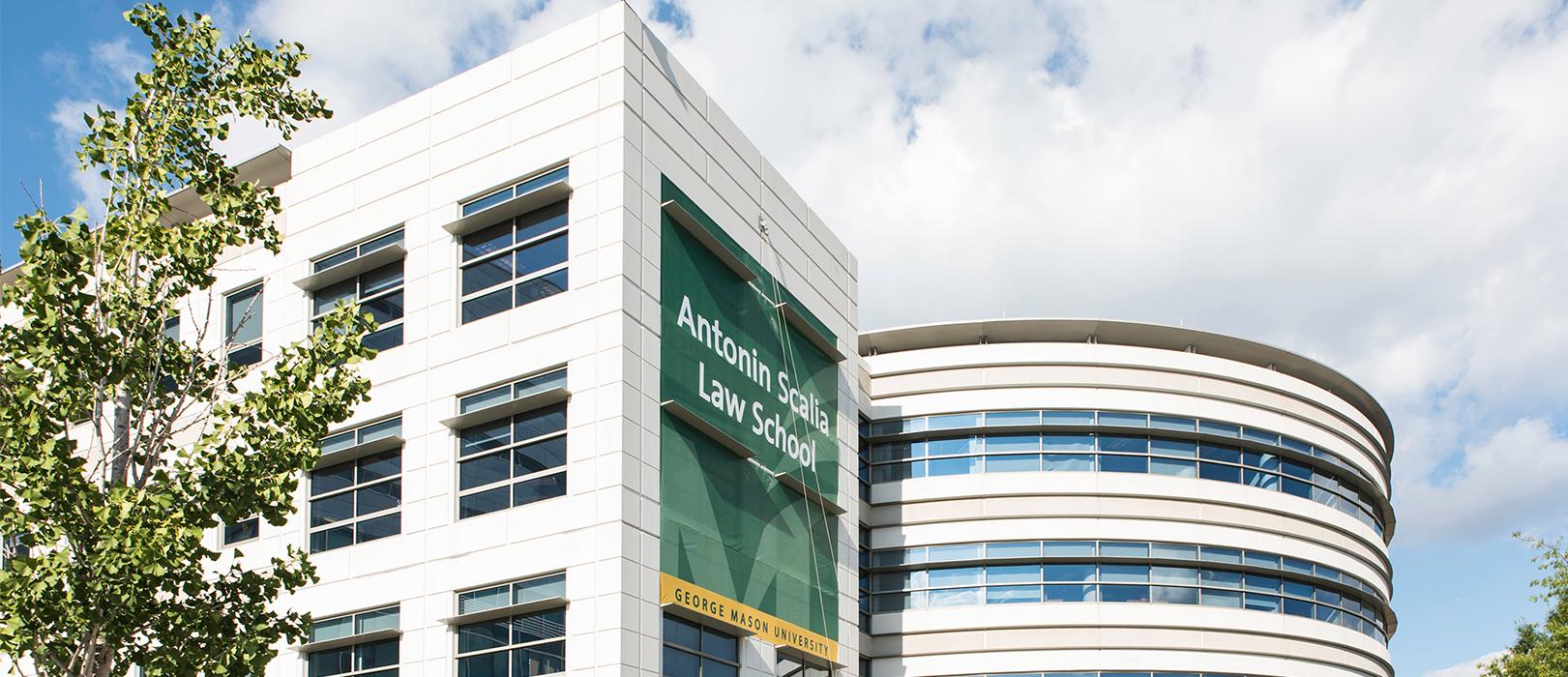 Building on a sunny day with a sign that says Antonin Scalia Law School