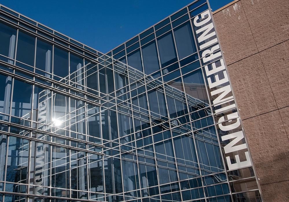 Architectural building with rectangular glass windows and 3D signage that says Engineering