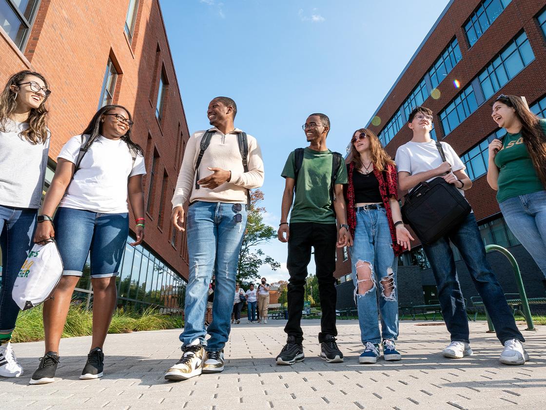 Several students walking together outside