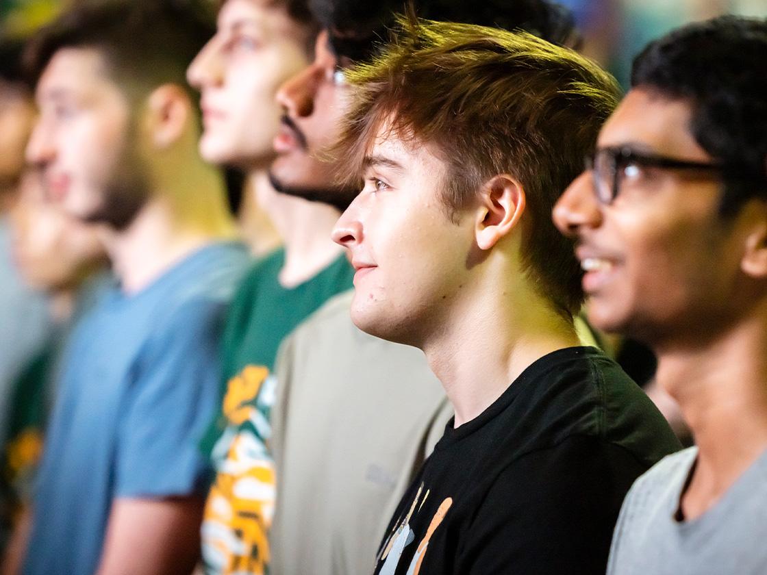 Close up of smiling students facing to the left