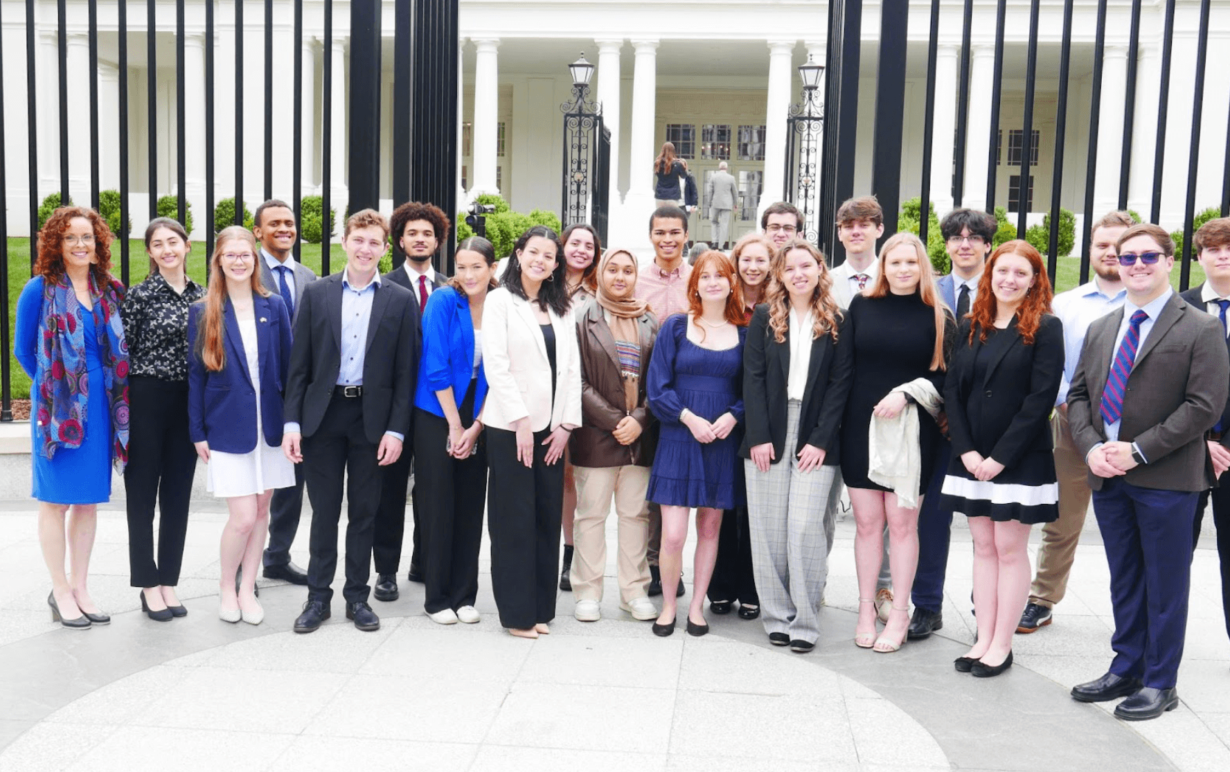 A group of people wearing business casual