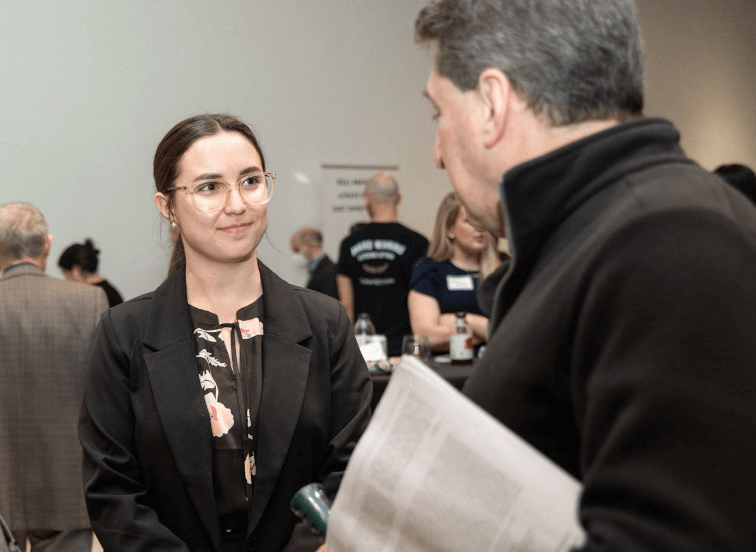 Student wearing a blazer and in discussion