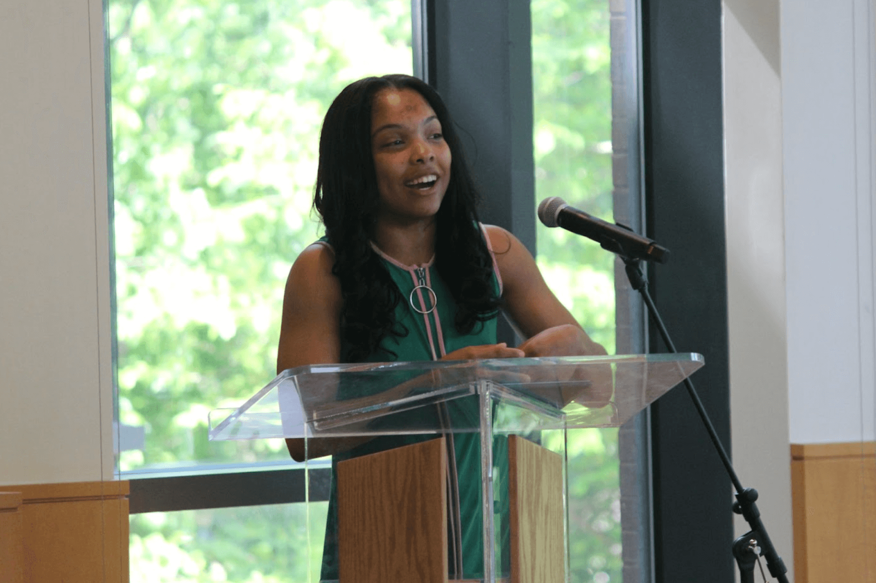 Student at podium giving a speech
