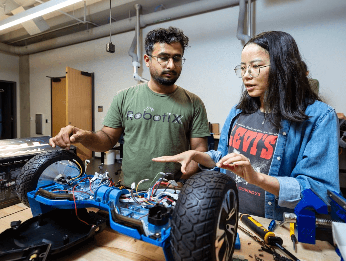 Two students working on a robot
