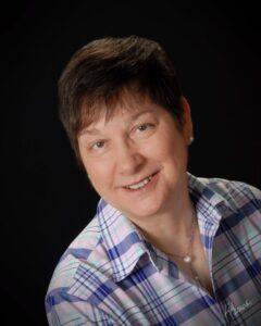 Portrait of Deborah Boehm-Davis against a dark background
