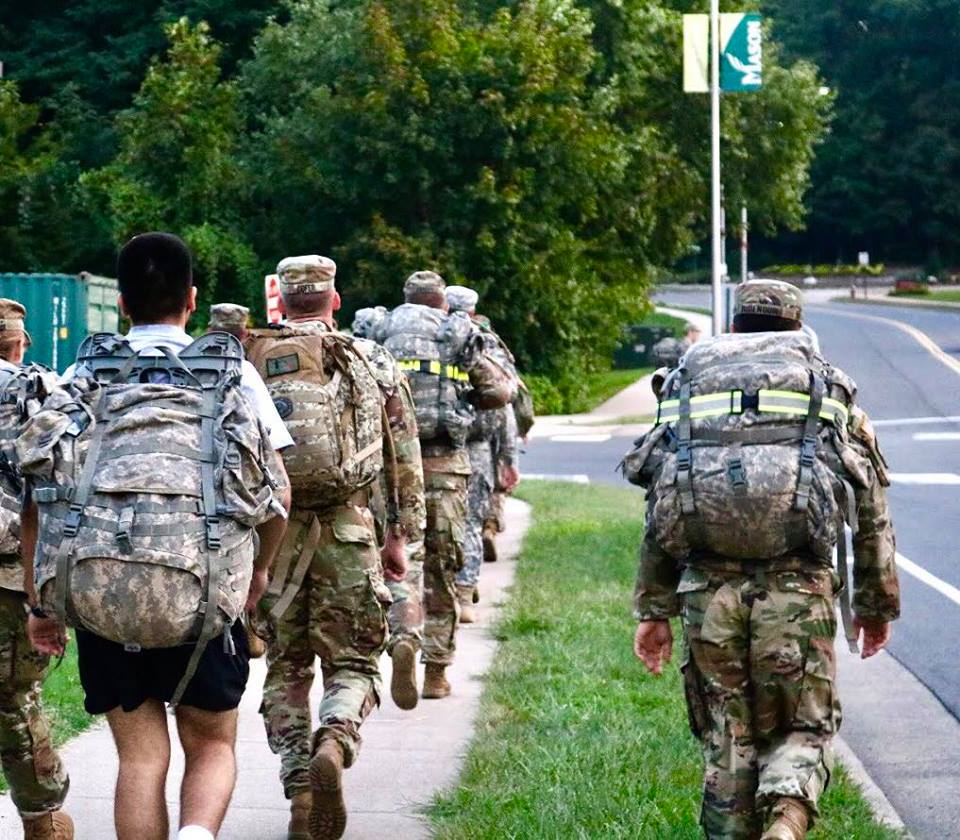 ROTC with backpacks and marching outside