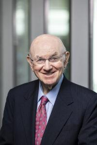 William Schneider in front of a blurred background