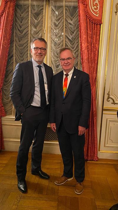 Dean Ozerdem stands beside Gordon McInally, President of Rotary International.