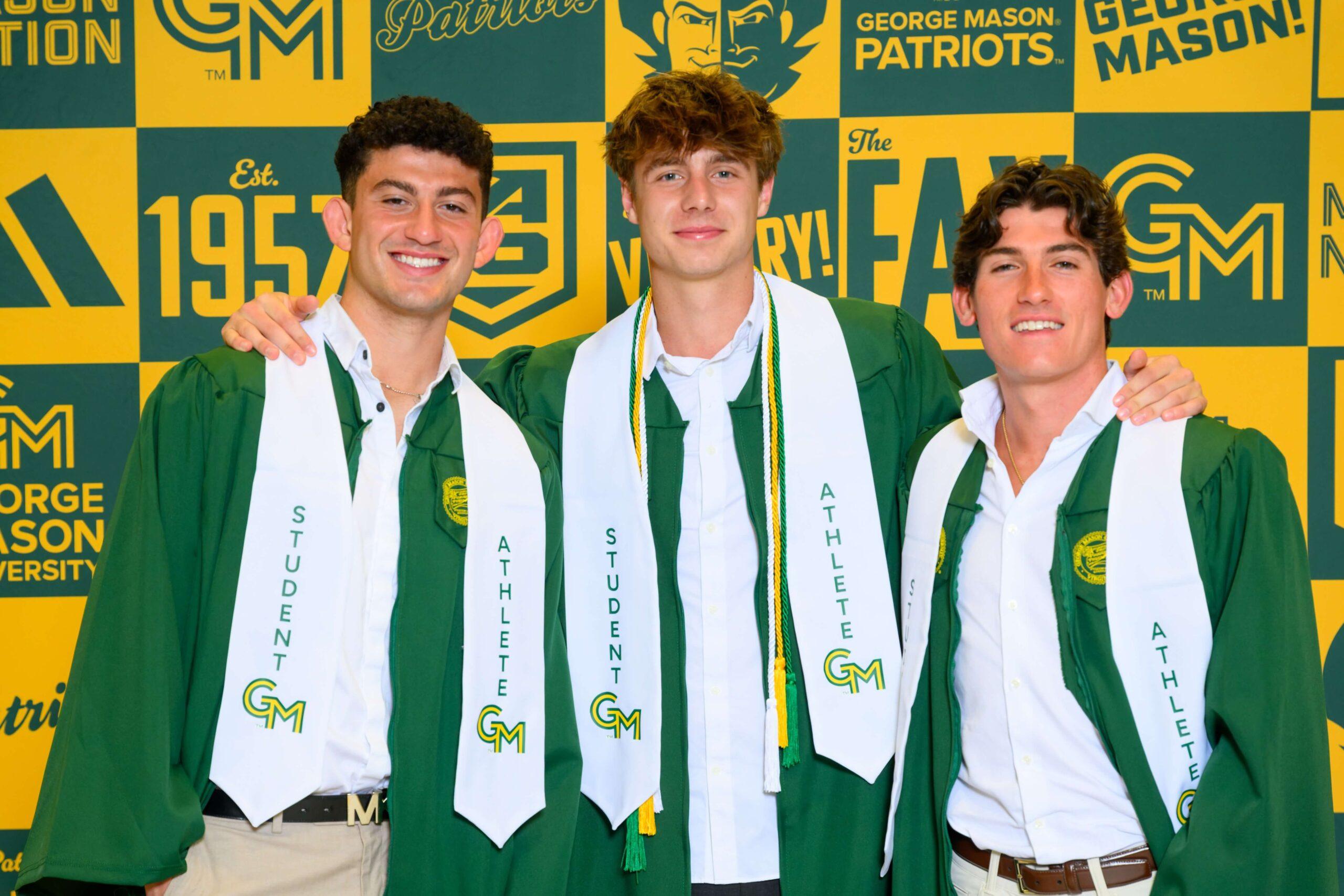 Three graduate athletes wearing their commencement stools