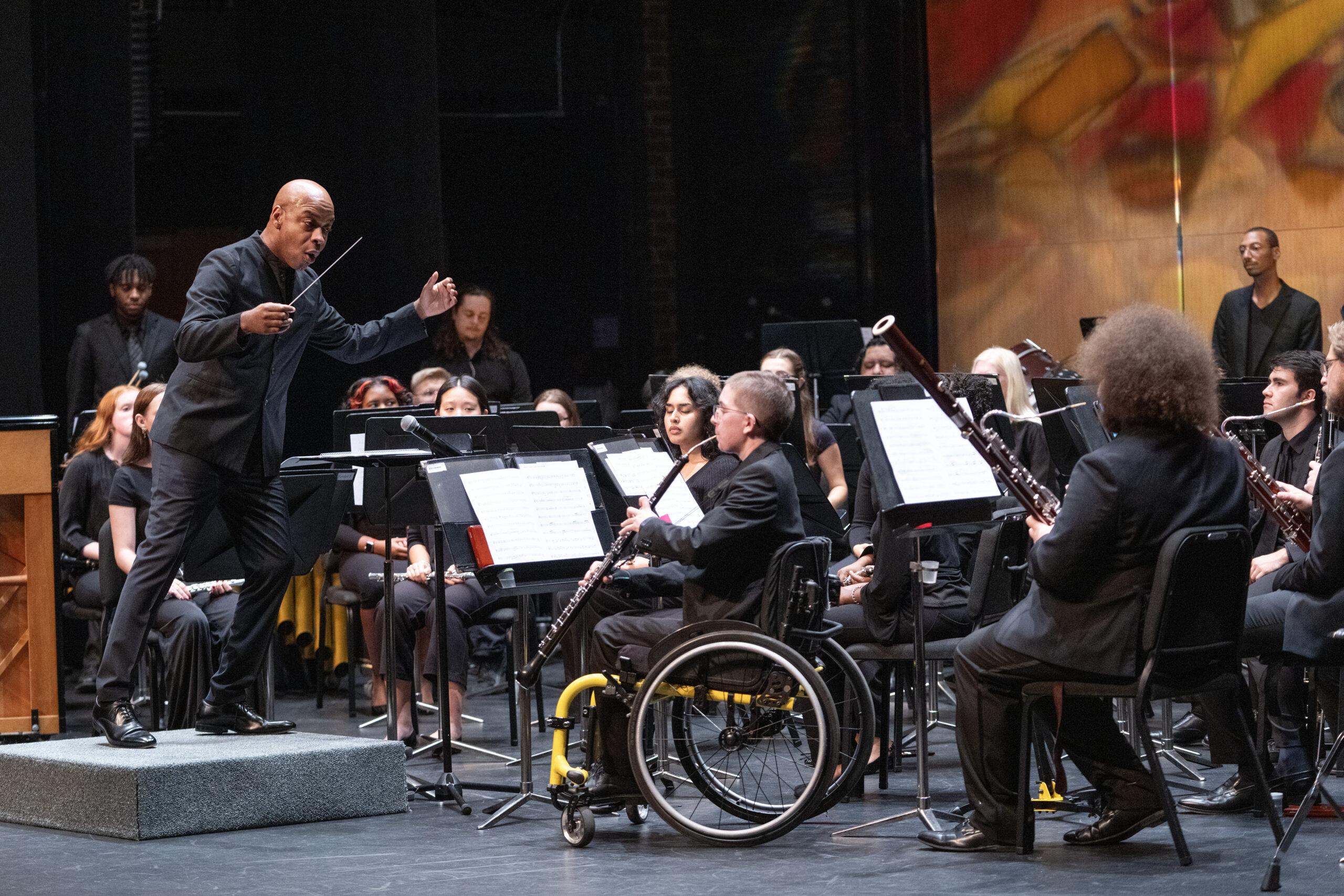 Conductor leading an orchestra.