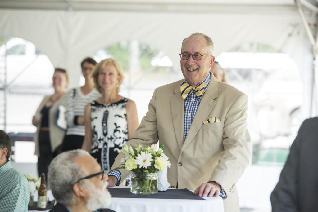 Former College of Visual and Performing Arts Dean Bill Reeder standing at an event.