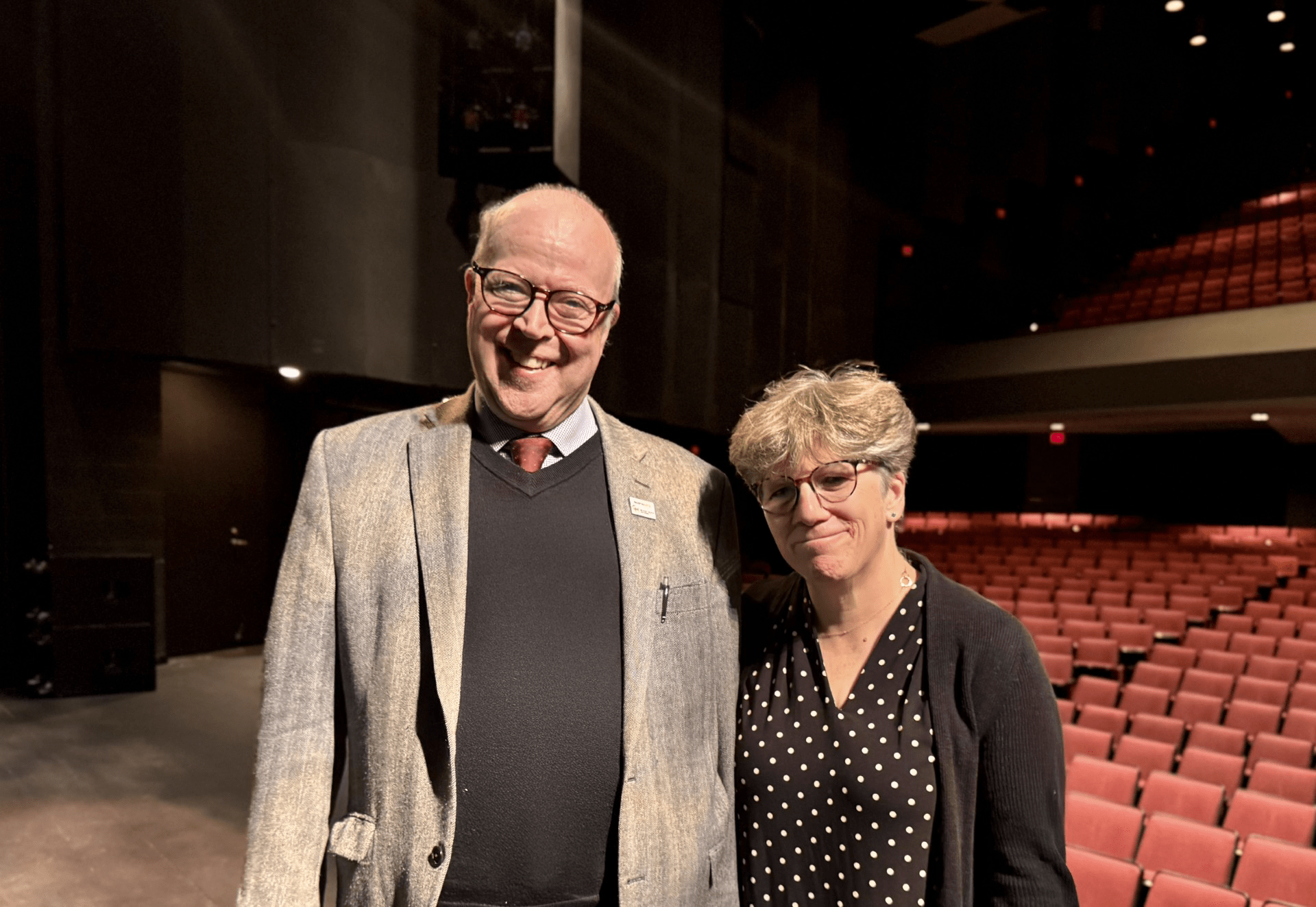 Dean Rick Davis and Julie Thompson stand together in a theater