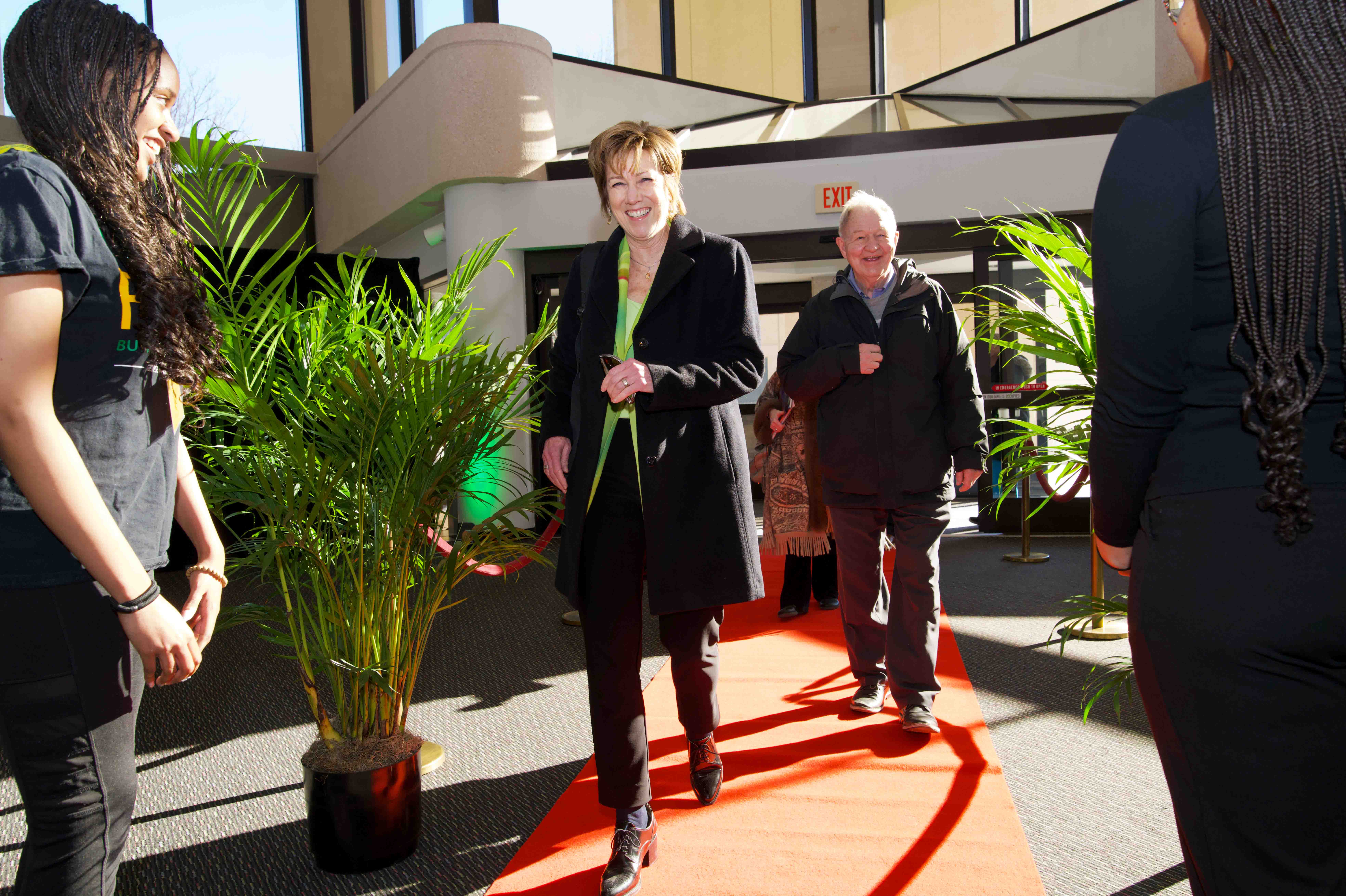 Two Celebrating Our Champions event attendees walking into the venue.