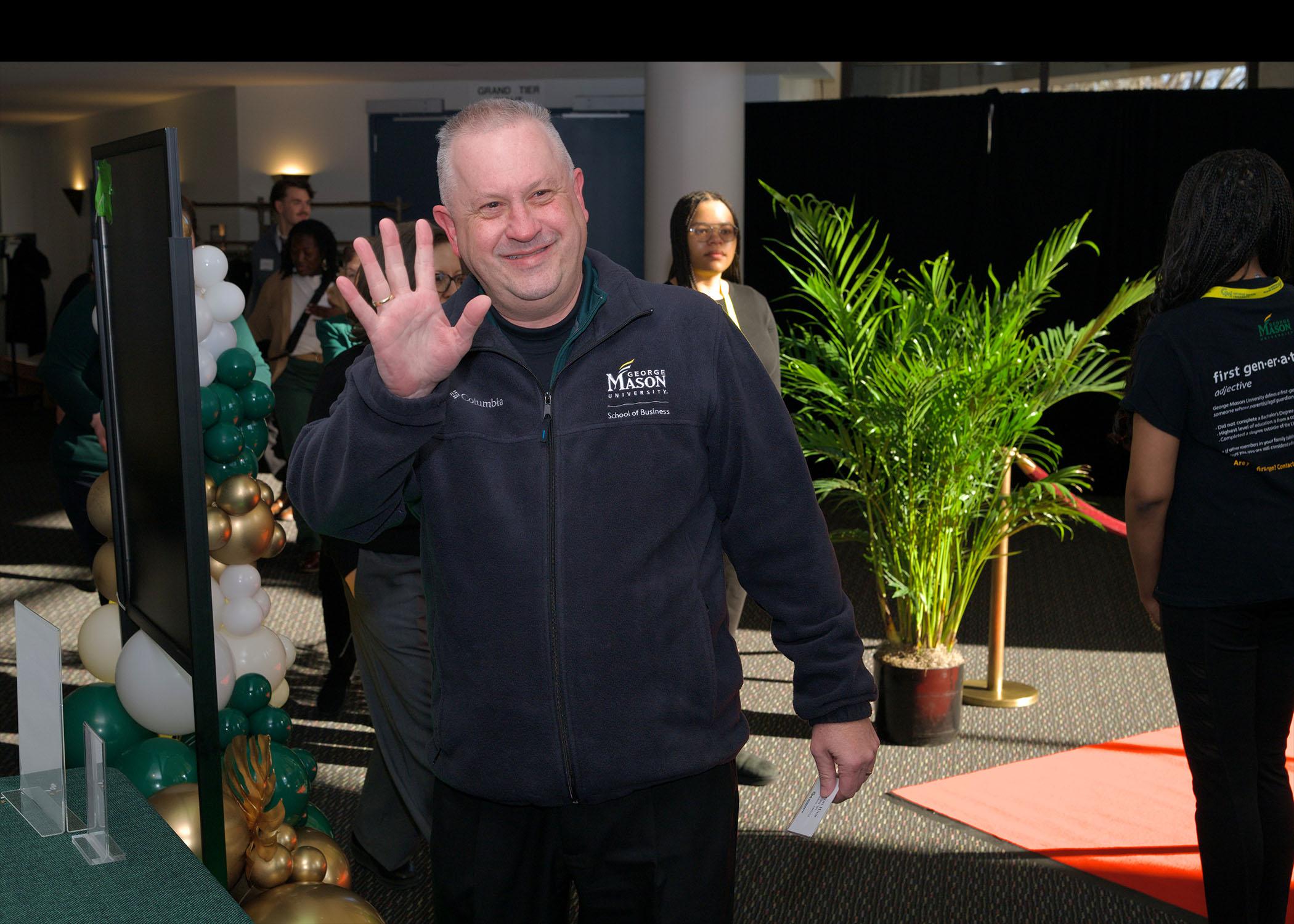 Event attendee walks into Celebrating Our Champions event venue.