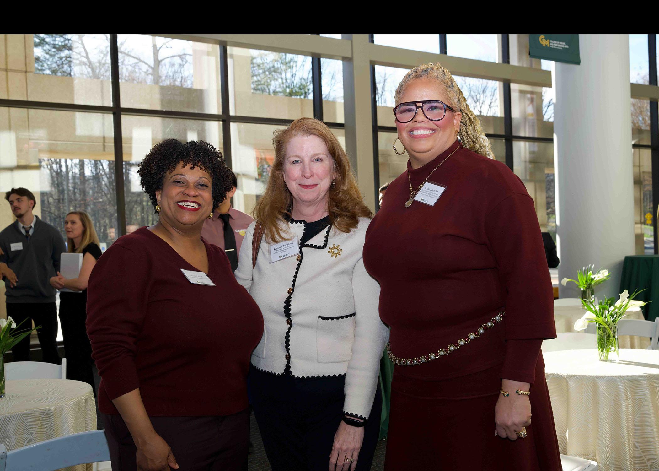 Robin Parker, Suzanne Terrillion , and Trishana Bowden stand together at Celebrating Our Champions event.