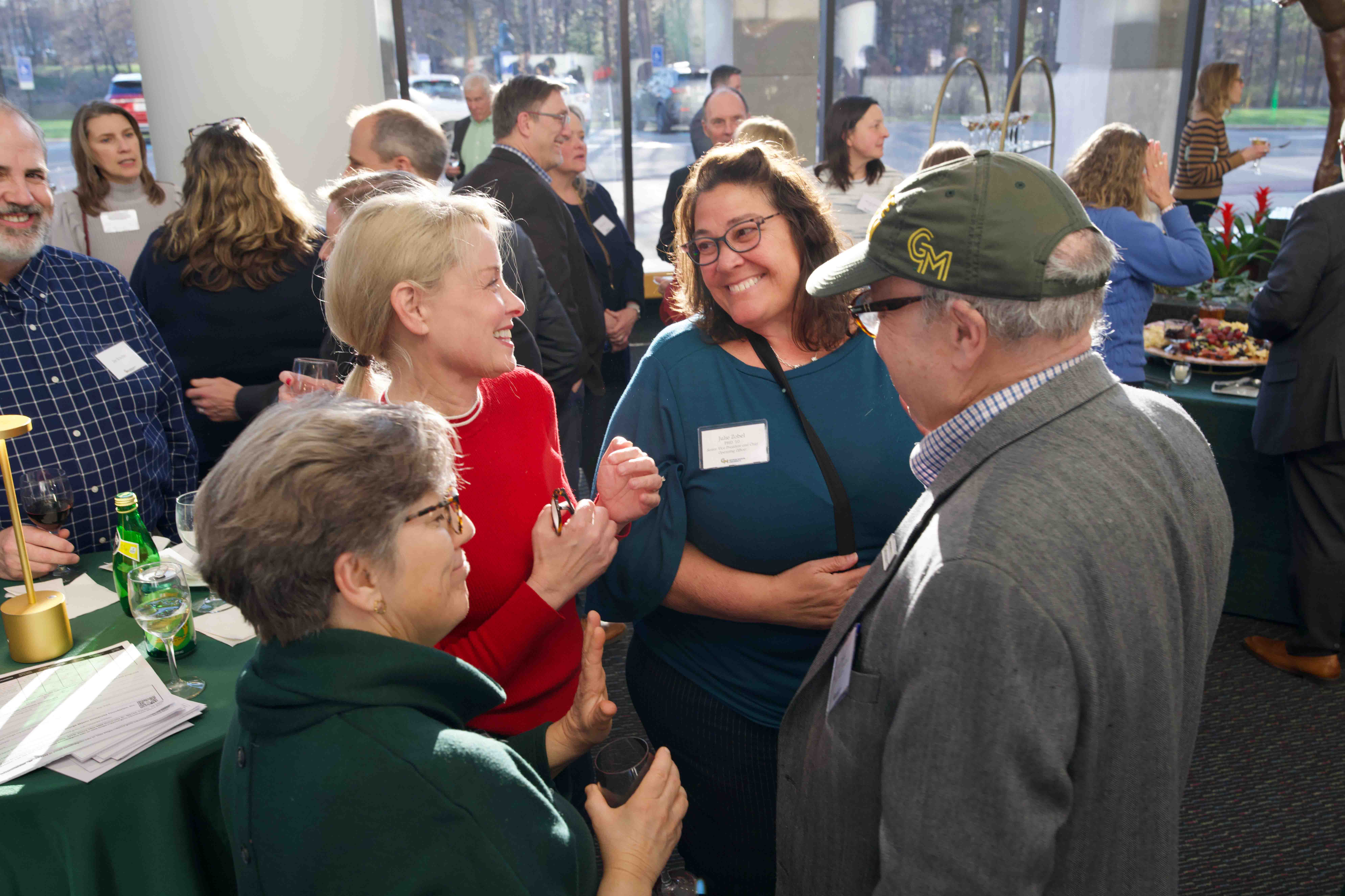 Attendees stand together at Celebrating Our Champions event.