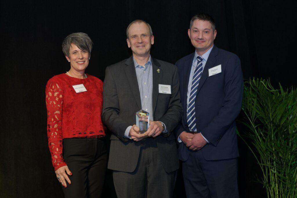 Keith Renshaw holding his award. 