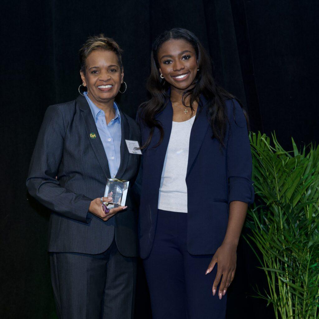 Nena Rogers holding her award.